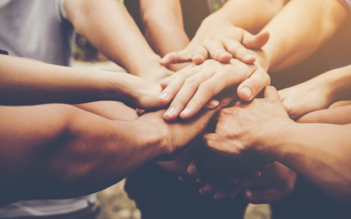 Business teamwork join hands together. Business teamwork concept